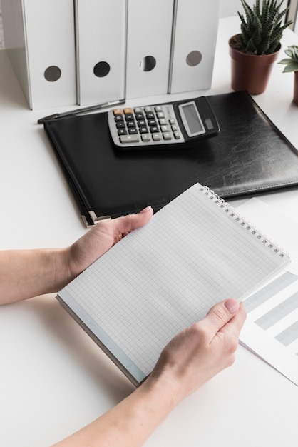 Free photo high angle business woman holding notebook