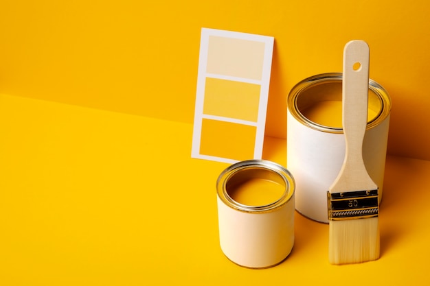 Free photo high angle cans with yellow paint