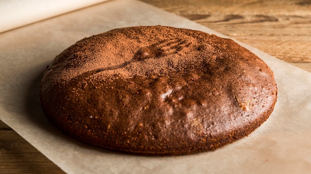 Free photo high angle chocolate cake with cocoa powder