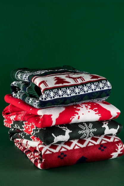 Free photo high angle christmas sweaters arrangement