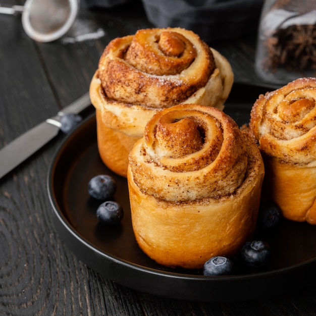 High angle cinnamon rolls and blueberries