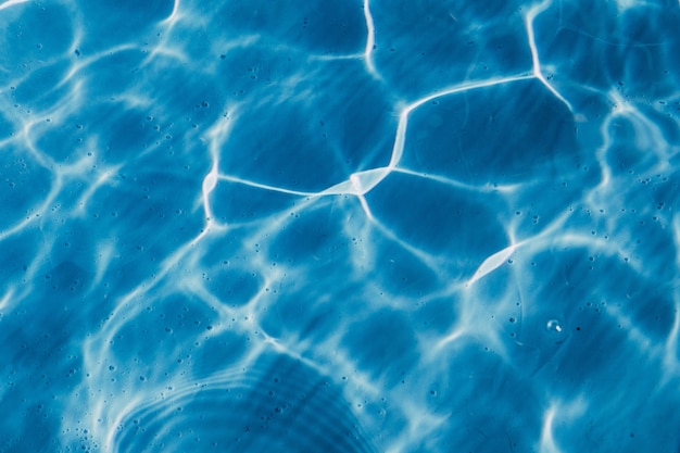 High angle closeup shot of a crystal clear swimming pool water