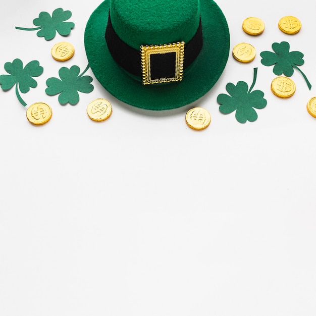 Free Photo high angle clovers, hat and coins