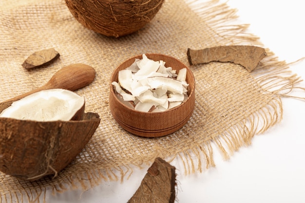 Free photo high angle of coconut with spoon and burlap