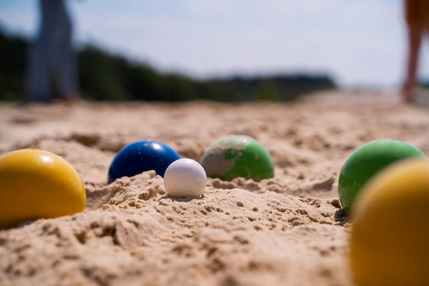 High angle colorful balls on sand