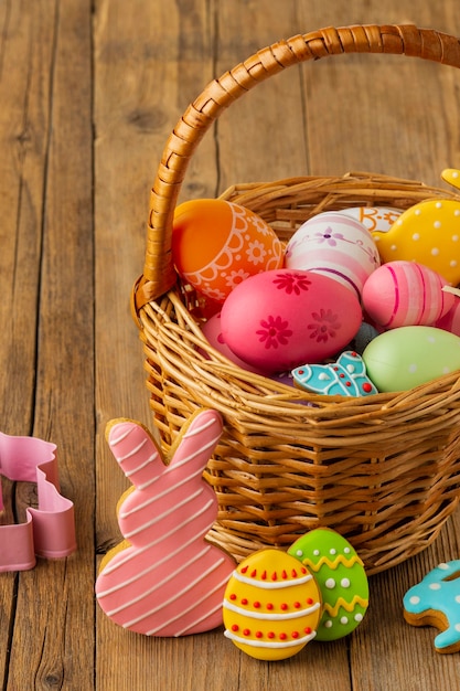 High angle of colorful easter eggs in basket with bunny