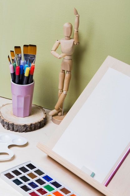 Free Photo high angle of colorful paint on desk