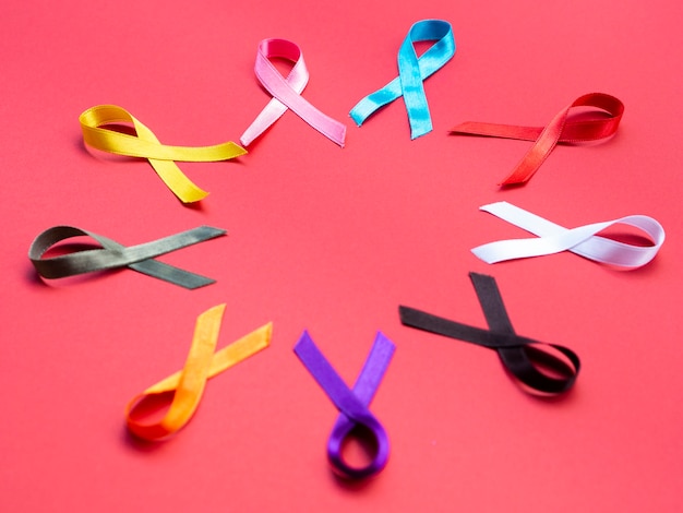 Free photo high angle colorful ribbons on red background