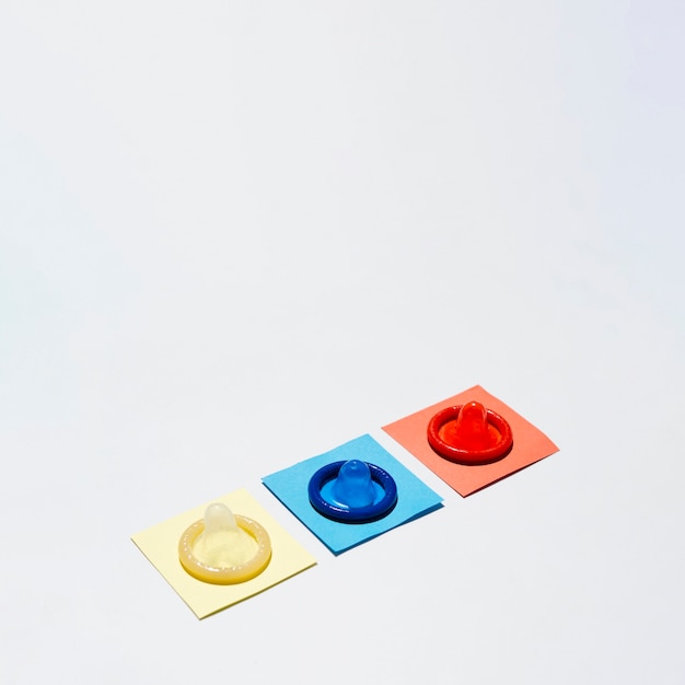 Free Photo high angle coloured condoms  with copy-space