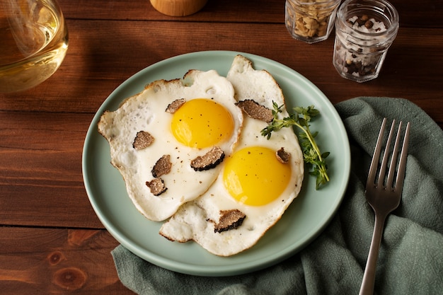 High angle cooked eggs and truffle