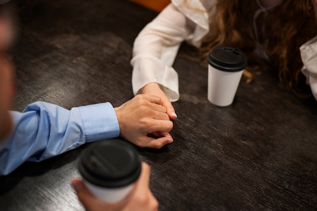 Free photo high angle couple having a bookstore date