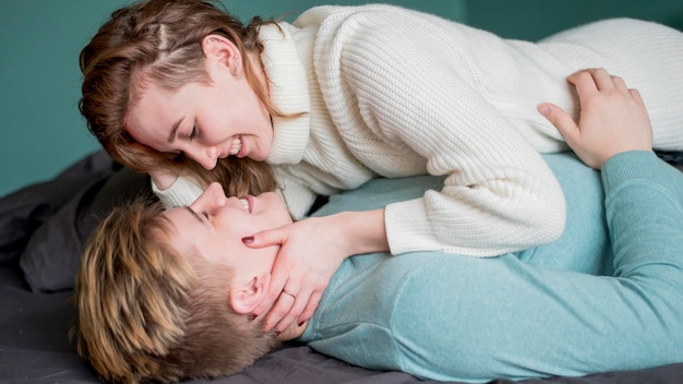 Free photo high angle couple sitting on couch