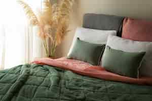 Free photo high angle cozy bed arrangement