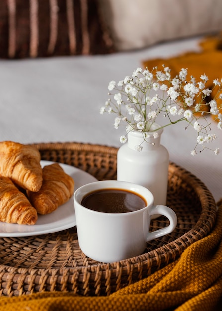 Free photo high angle croissants and coffee cup