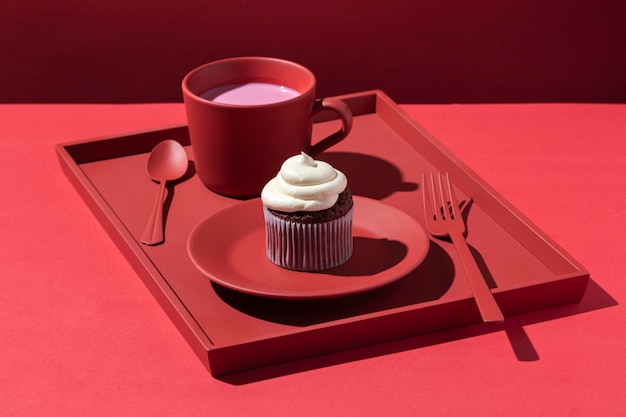 Free photo high angle cupcake on red plate