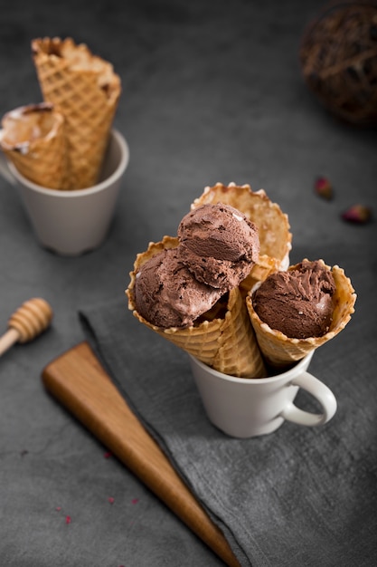 Free photo high angle cups with ice cream cones