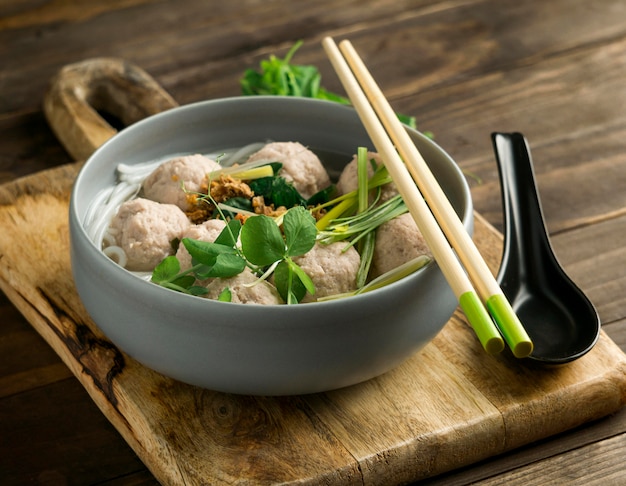 Free photo high angle delicious bakso bowl composition