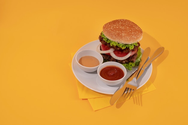 Free Photo high angle delicious burger and sauce