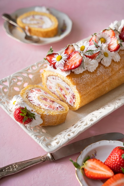 Free photo high angle delicious cake and strawberries