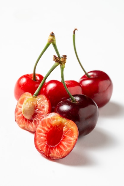 Free photo high angle delicious cherries on white background