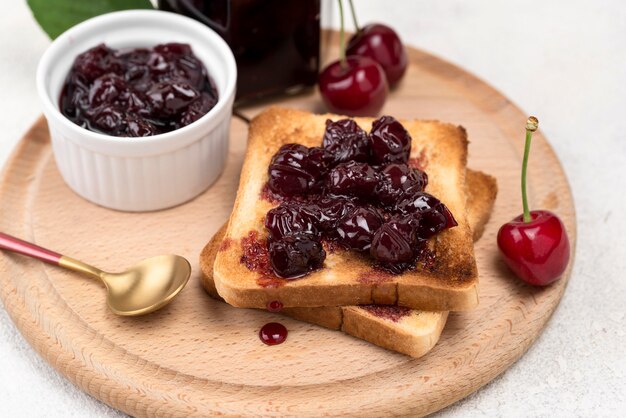 High angle delicious cherry jam on bread