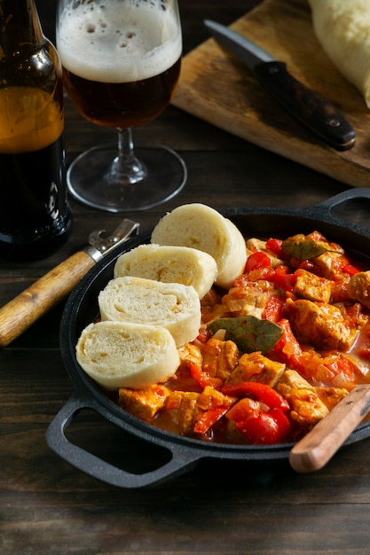 Free photo high angle delicious goulash and bread still life