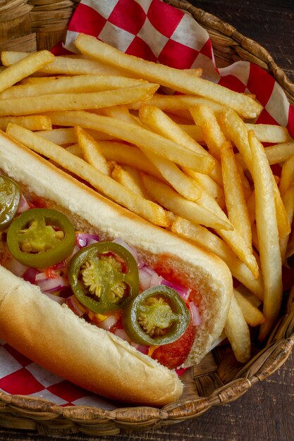 High angle delicious hot dog and fries