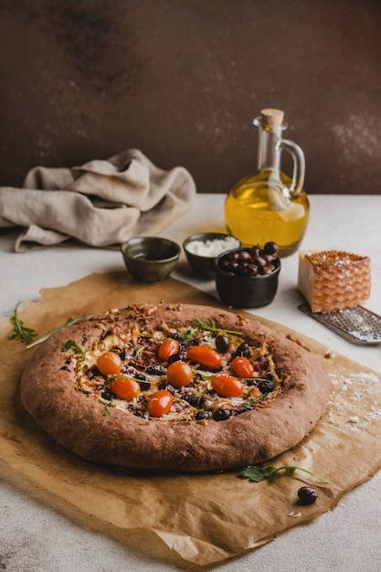 High angle of delicious pizza with parmesan cheese and tomatoes