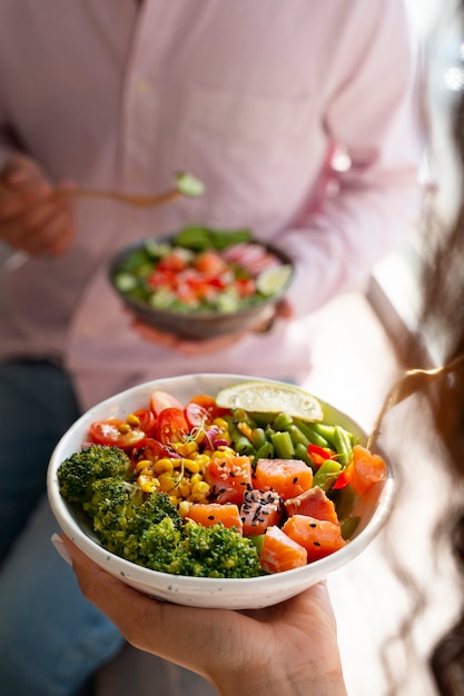 Free Photo high angle delicious salmon bowl indoors