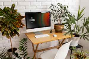 Free photo high angle desk arrangement and plants