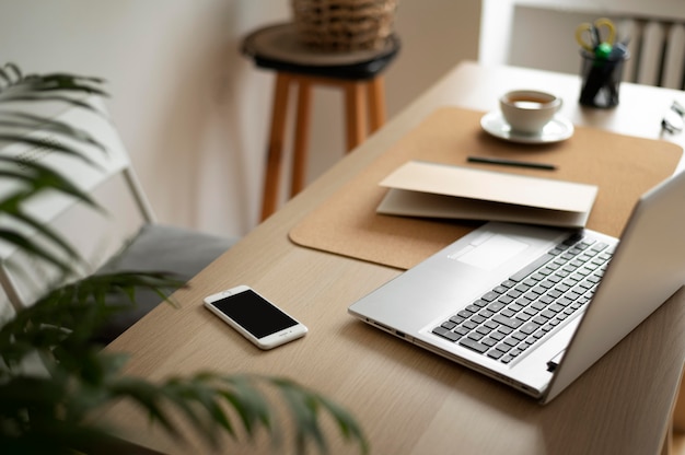 Free photo high angle desk arrangement with laptop