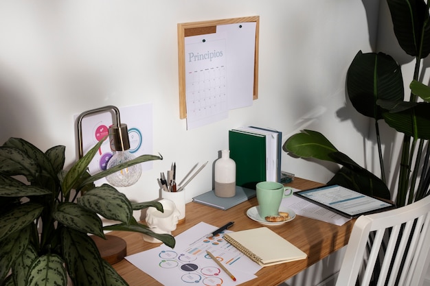 Free photo high angle desk arrangement with notebooks and statistics