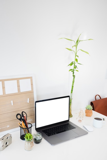 High angle desk items with laptop