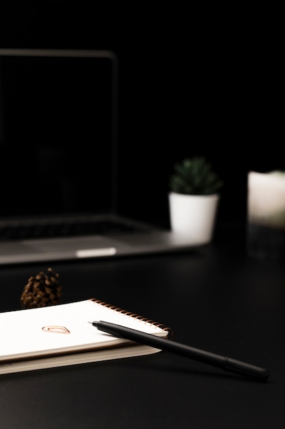 Free photo high angle of desktop with succulents and notebook