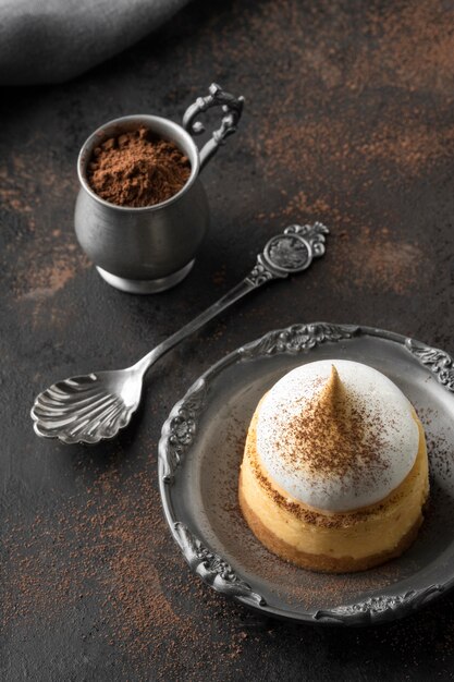 High angle of dessert on plate with cocoa powder