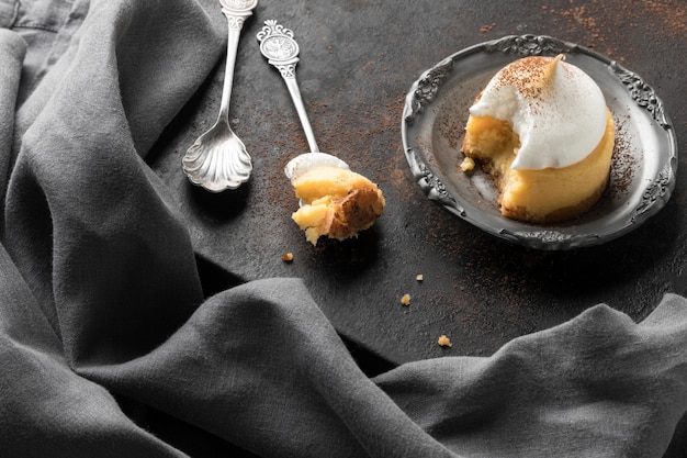 Free Photo high angle of dessert with spoons and cloth