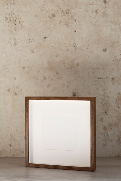 Free photo high angle empty wooden frame