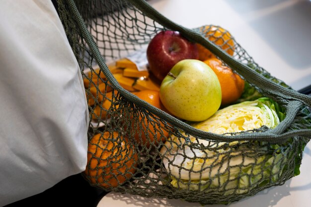 High angle fabric bag with fresh fruits