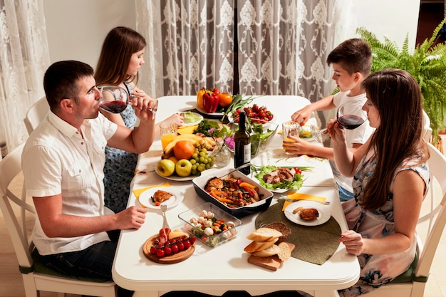 High angle of family eating at dinner table