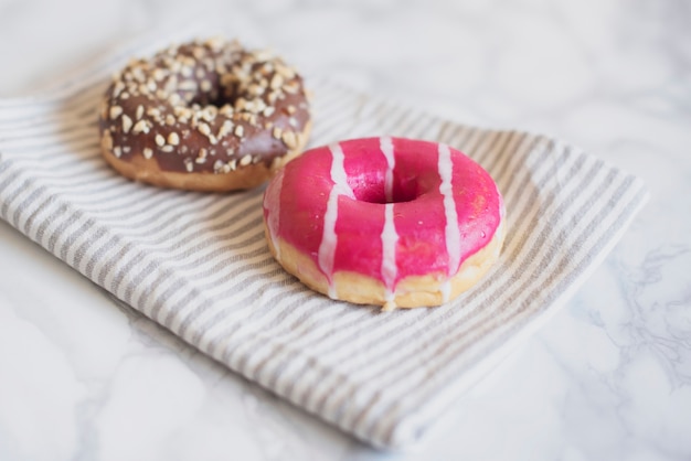 High angle flavored doughnut on towel