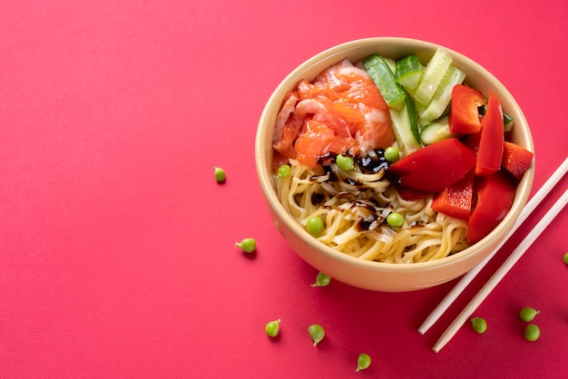 High angle food bowl and chopsticks