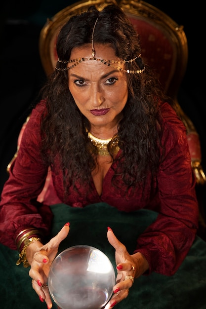 High angle fortune teller with crystal globe