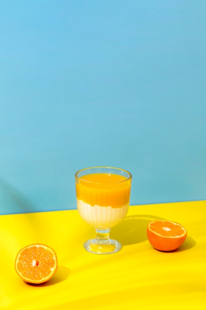 Free photo high angle fresh orange smoothie