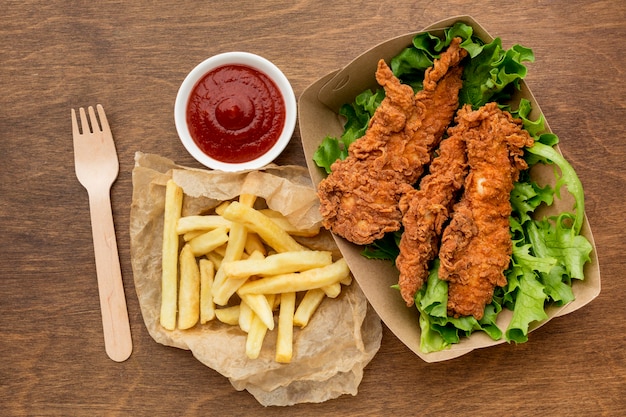 Free photo high angle fried chicken and fries with ketchup