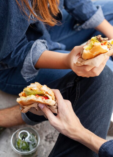 High angle of friends having burgers