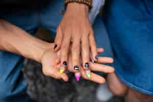 Free photo high angle friends with beautiful manicures