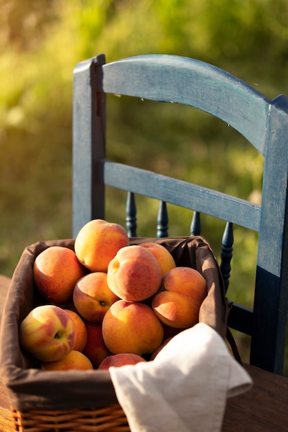 Free Photo high angle fruit basket on chair