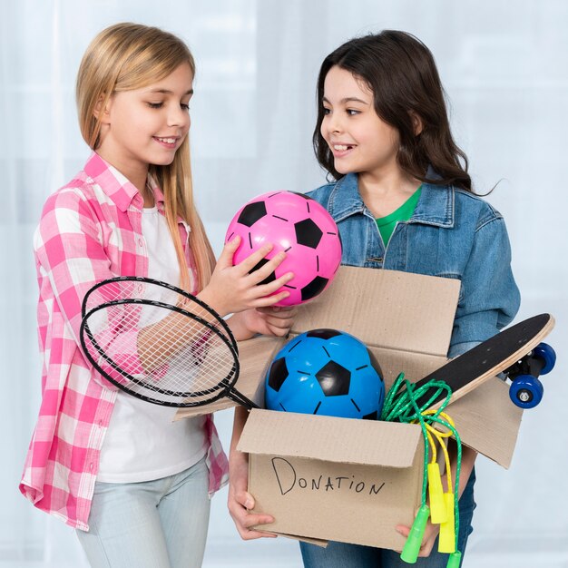 High angle girl holding donation box