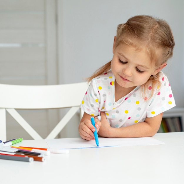 High angle girl at home drawing