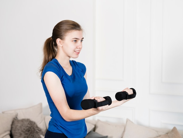 High angle girl training with weights